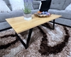 Picture of HENMAN 110 RECTANGLE TOP AND FLARED LEG COFFEE TABLE *OAK AND BLACK